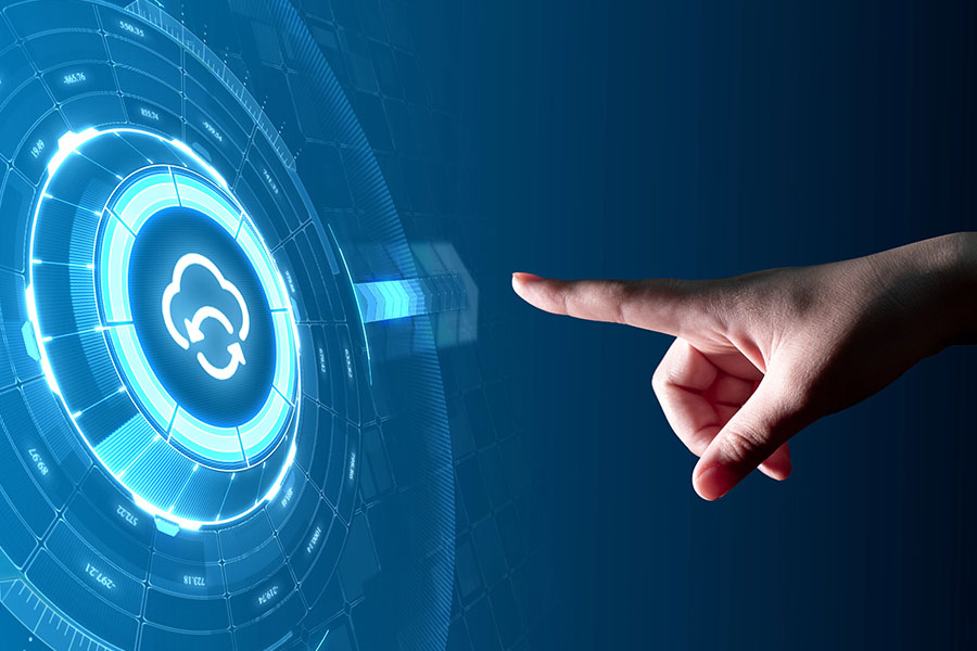 A hand pointing at a digital interface with a cloud icon, illustrating how to integrate cloud solutions with existing IT infrastructure