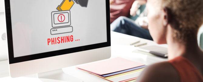 Business Woman Working on Computer That Has a Phishing Threat