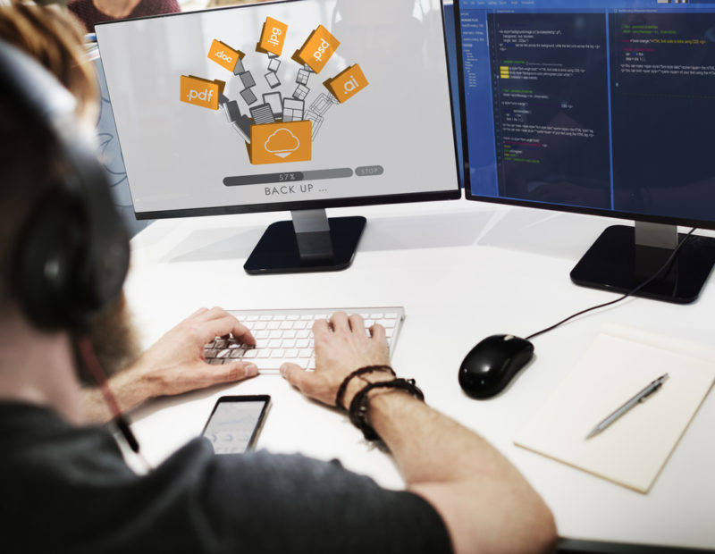 Business Data Backup Strategy: How to Protect Critical Company Data 4 Guy on a computer actively engaged in data backups and exploring 'Differential Backups' as part of his comprehensive data protection strategy