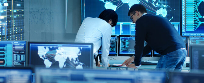 Cybersecurity expert monitoring network security in a control center, ensuring fast and thorough penetration testing in Japan