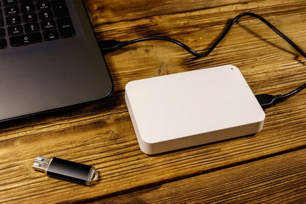 External hard drive connected to laptop Ensuring Data Resilience with 3-2-1 Backup Rule