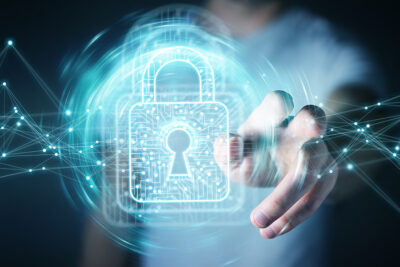 Person touching a digital padlock symbolizing IT security in Hong Kong