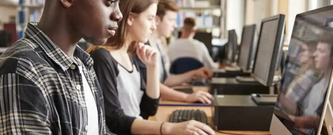 Students engaged in a focused classroom session, diligently working on computers concept image for education cybersecurity