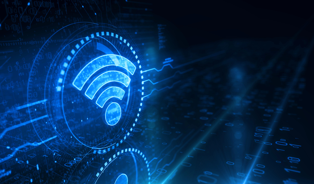 What is a Wi-Fi Heatmap? 2 Digital Wi-Fi heatmap visualization showing a glowing wireless signal icon over a blue data grid background with network analytics and binary code.