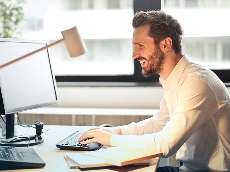 beard-chair-computer-mobile team working on IT support in their Tokyo Japan office