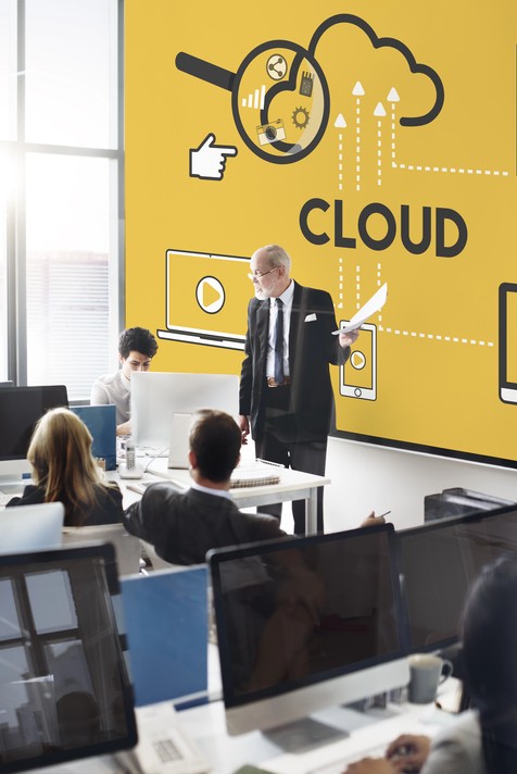 Business professional presenting cloud technology concept in an office, highlighting Singapore Azure cloud services with a collaborative team.