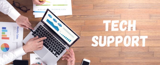 tech support concept with it team working at deak