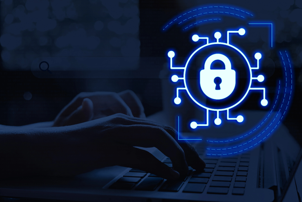 Endpoint management concept showing a glowing security lock icon over a laptop keyboard