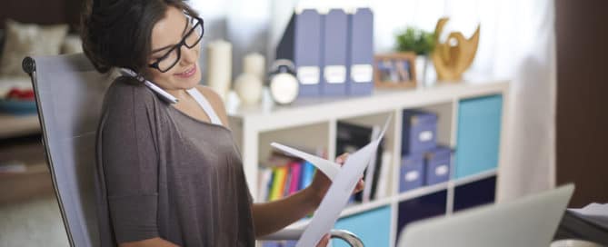 Woman working from home feeling happy